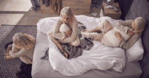 an overhead view of two people sitting on a bed