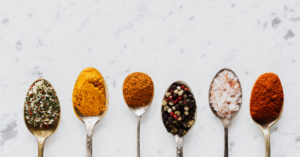 spoons with different types of spices on them