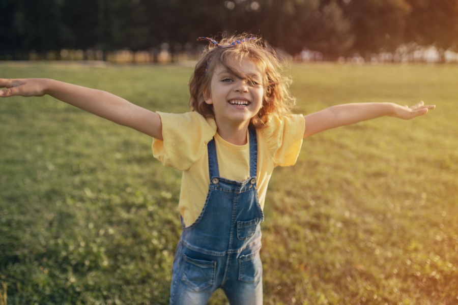 Child with ADHD playing outdoors
