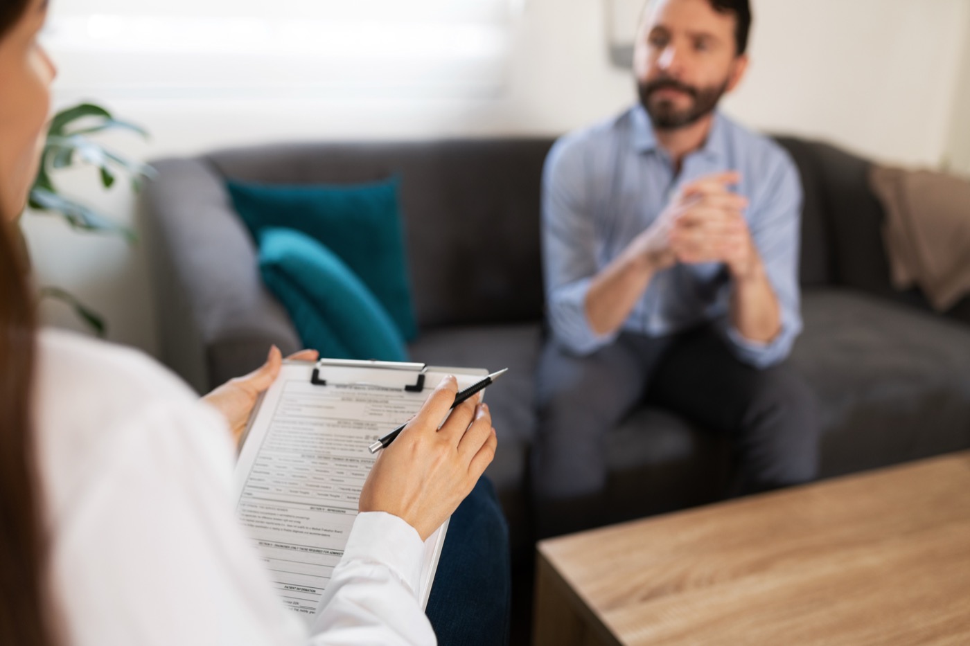 Physician taking notes during a personalized treatment planning session