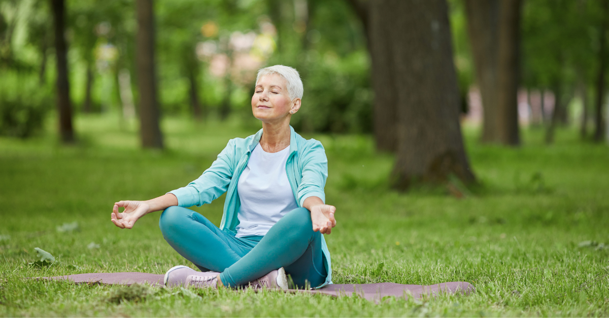 woman meditating in the park